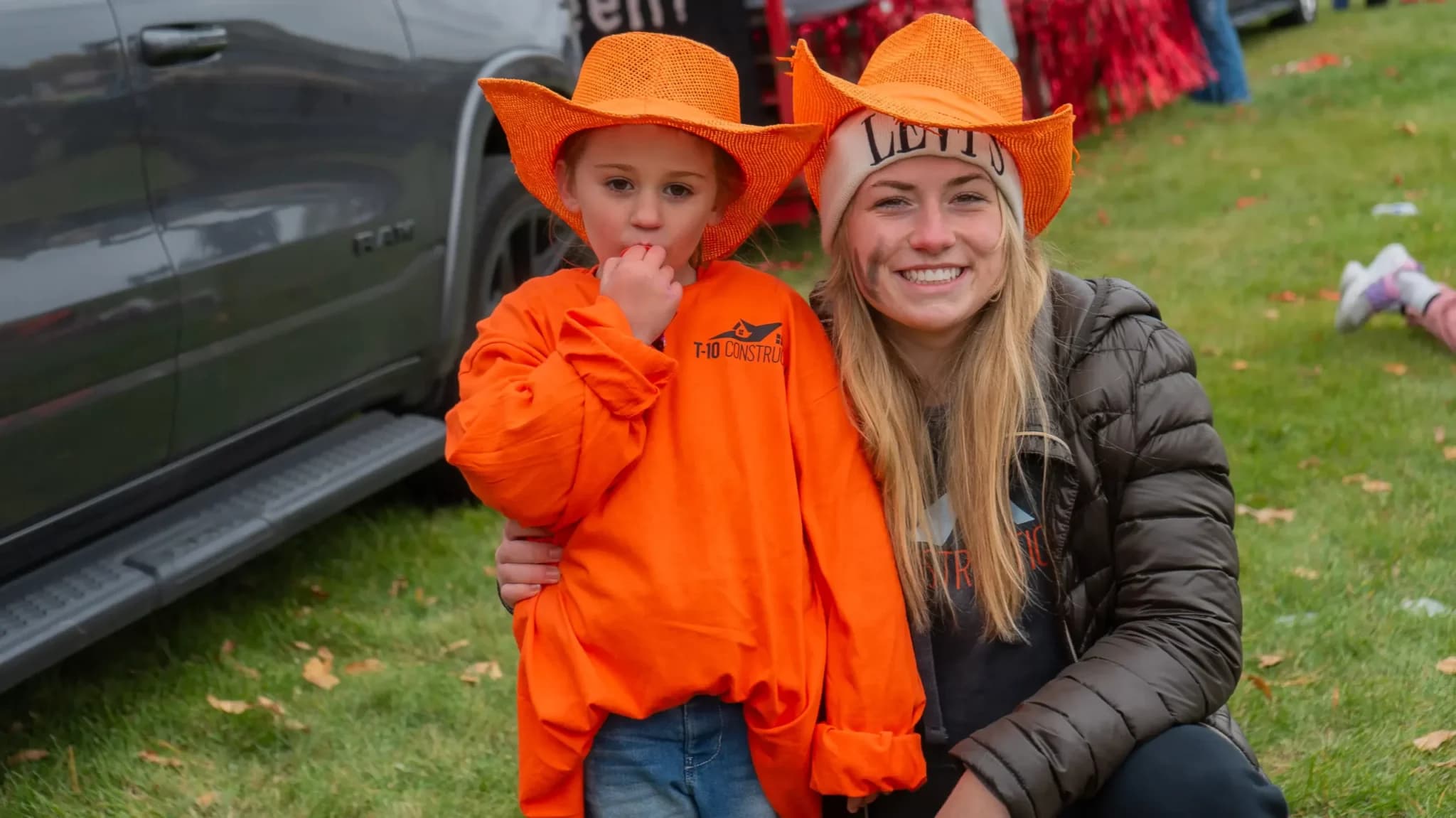 T-10 Construction family members wearing orange T-10 gear