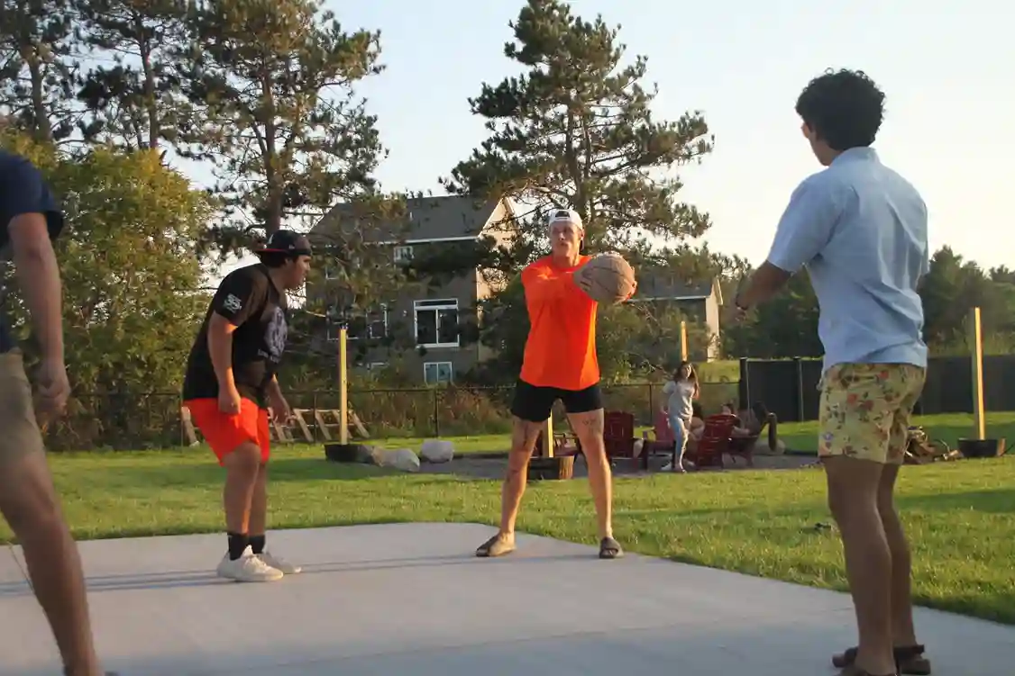 Boys playing basketball at a company party.