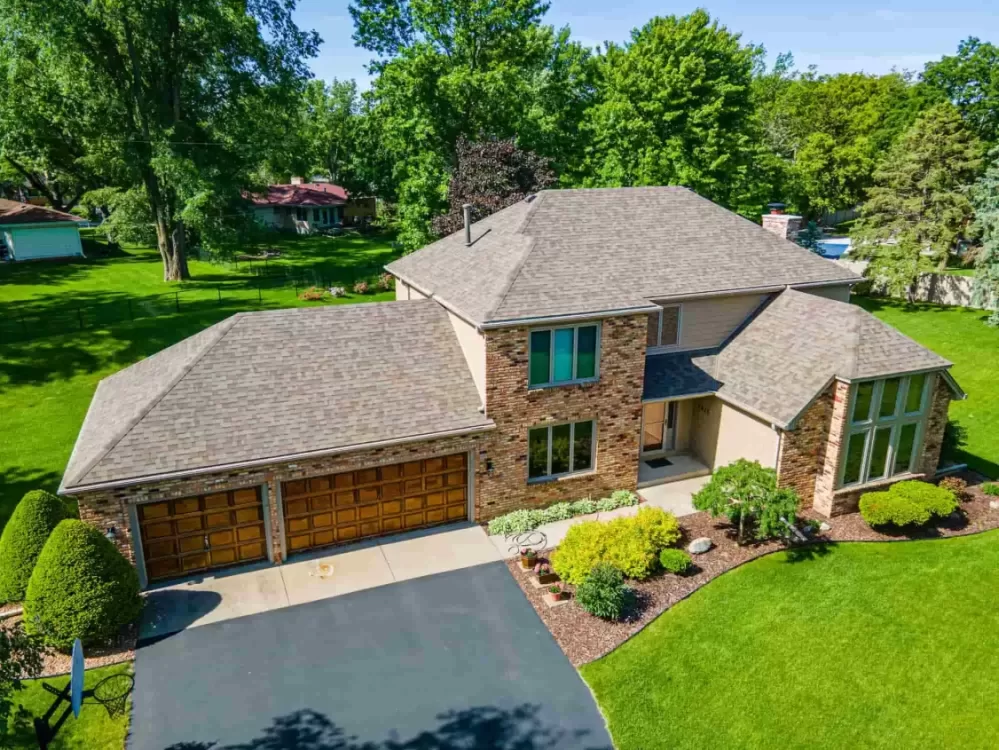 Drone photo of house with greenery in the background