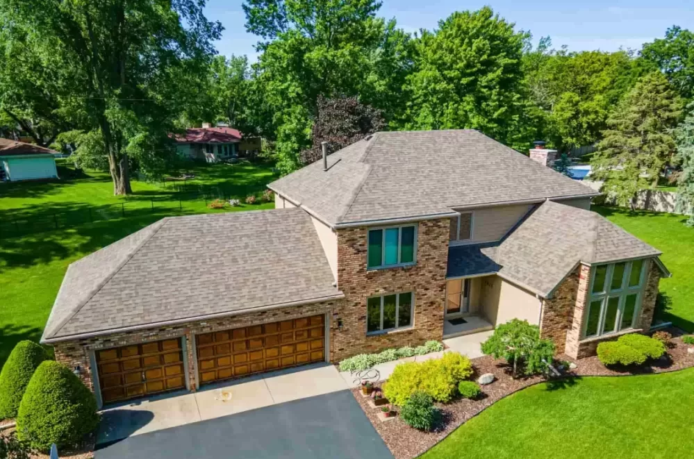 Drone photo of house with greenery in the background