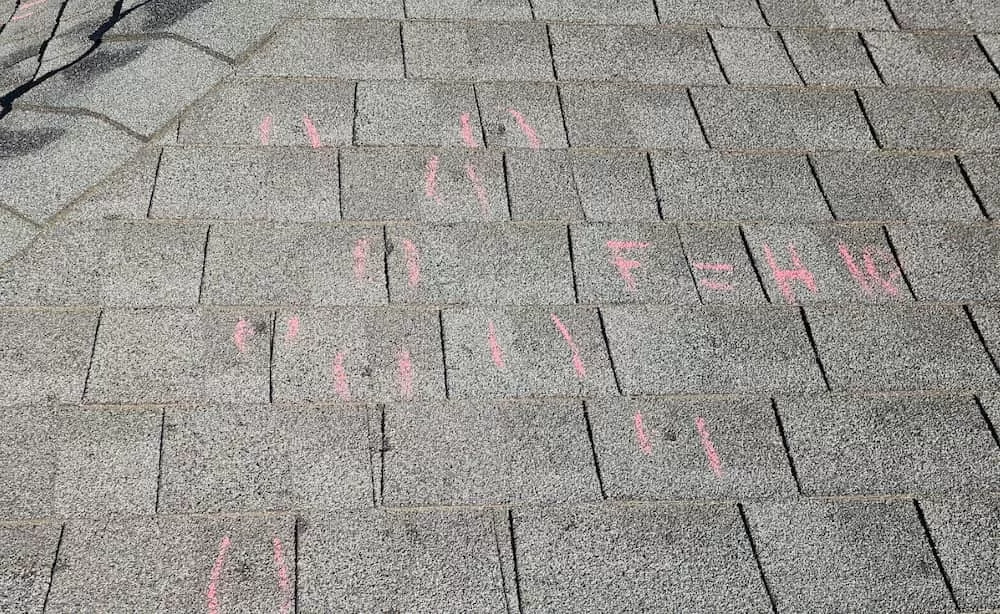 Roof with markings of hail damage